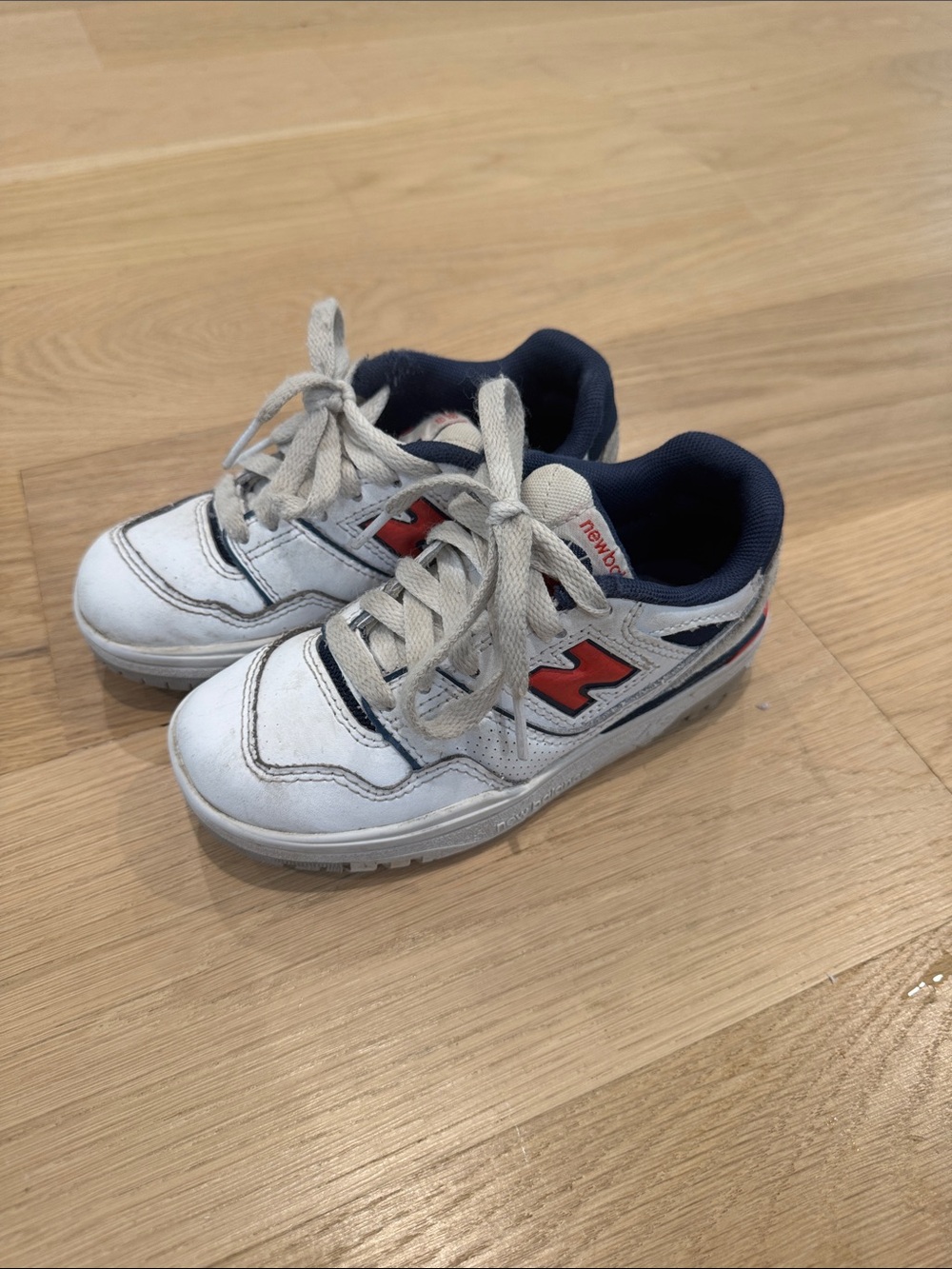 New Balance Kids White Sneakers with Navy Lining and Red 'N'